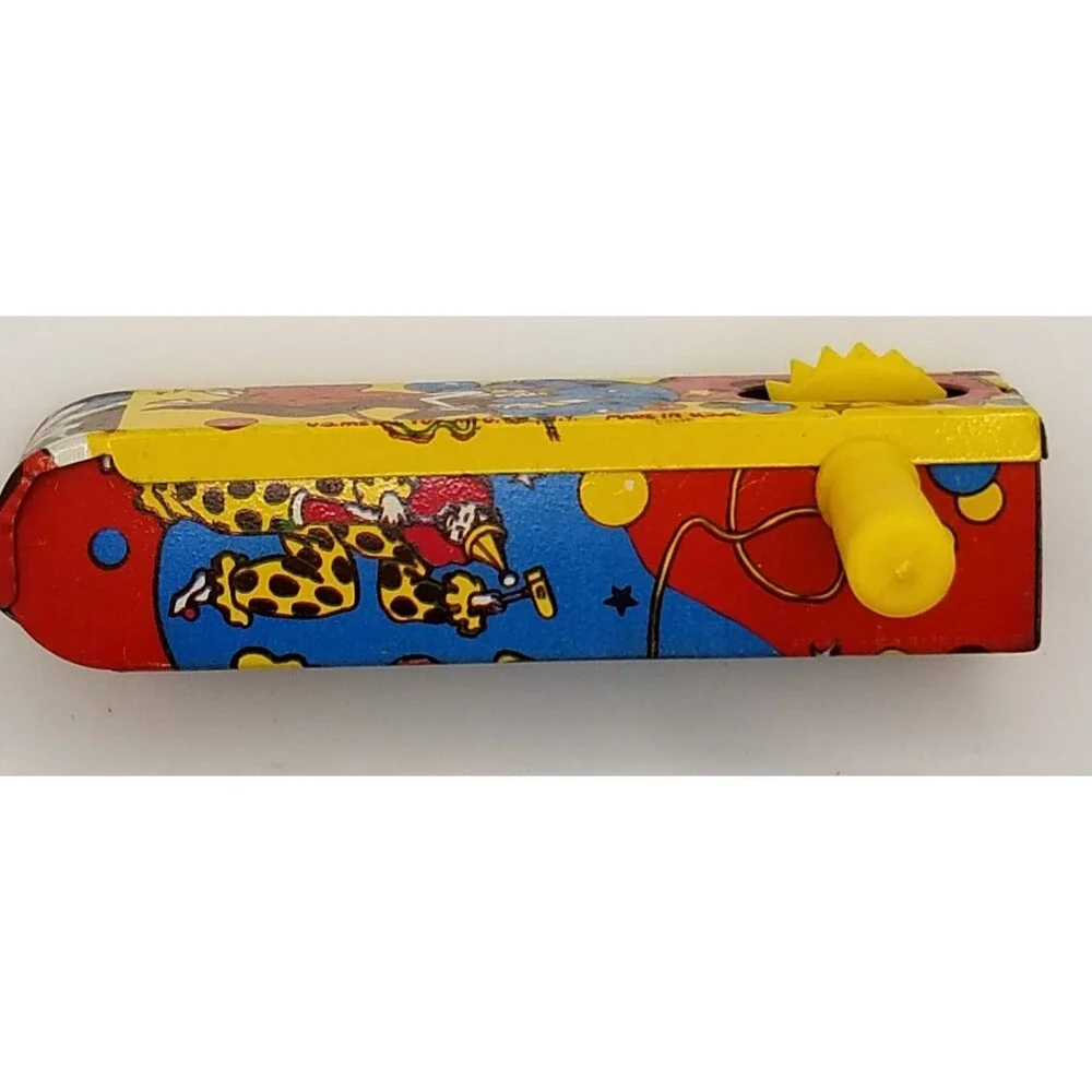 vintage tin lithograph ratchet style US Metal Toy Co noisemaker party theme